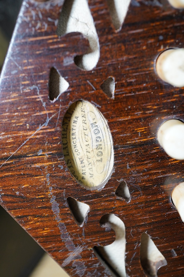 A leather cased mid 19th century Lachenal, London, 23 button concertina. Condition - fair to good, some wear to the case, the bellows appear sound and strong.